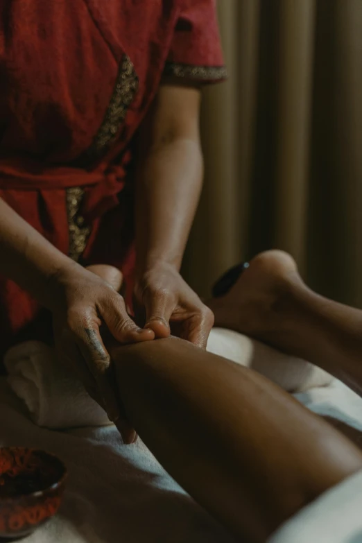 a woman getting a foot massage at a spa, unsplash, renaissance, indonesia, thumbnail, shot from cinematic, black