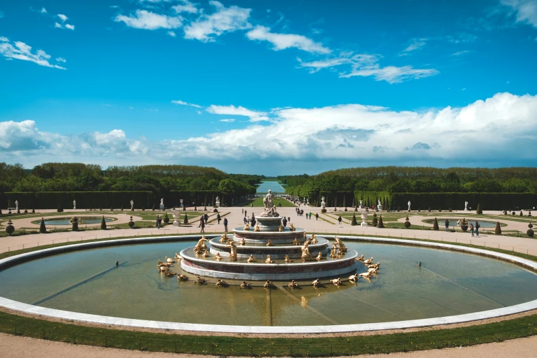 a large fountain in the middle of a park, pexels contest winner, rococo, baroque marble and gold in space, lagoon, conde nast traveler photo, france