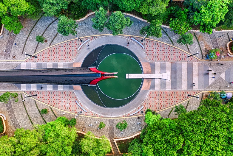 an aerial view of a fountain surrounded by trees, pexels contest winner, conceptual art, santiago calatrava, panoramic shot, moholy nagy, hangzhou