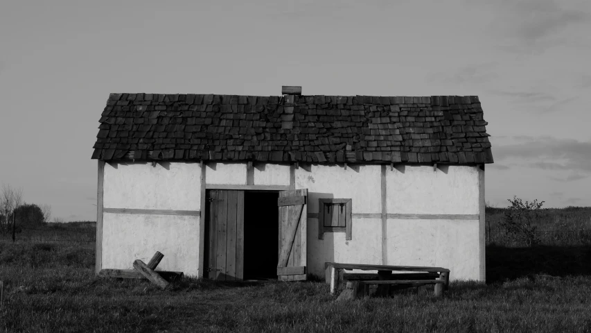 a black and white photo of a small house, a black and white photo, pexels contest winner, renaissance, background image, farming, historically accurate, modelling