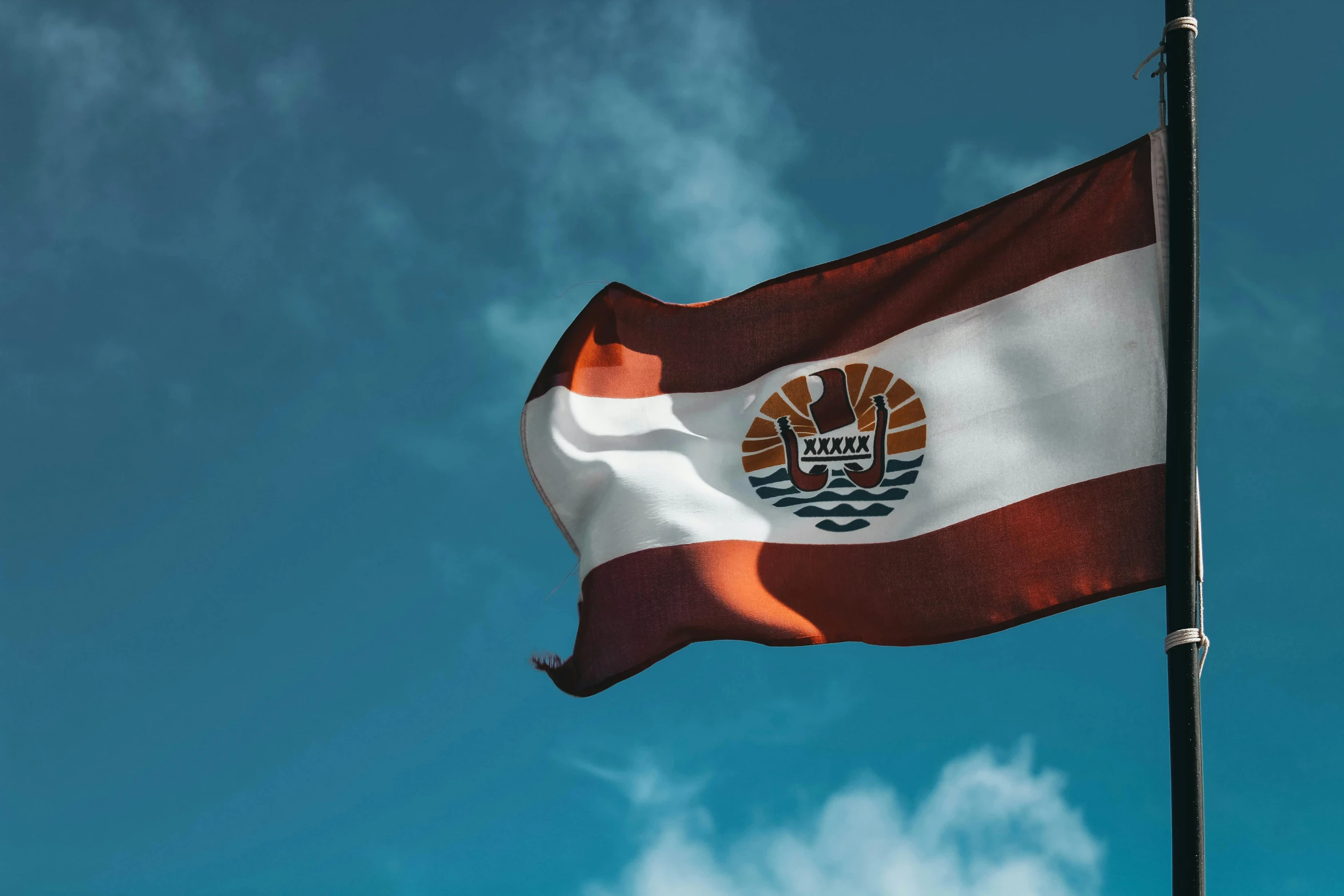 a flag waving in the wind against a blue sky, a digital rendering, by Daniel Lieske, shutterstock contest winner, hurufiyya, orange and white, tenochtitlan, maroon and white, 🚿🗝📝