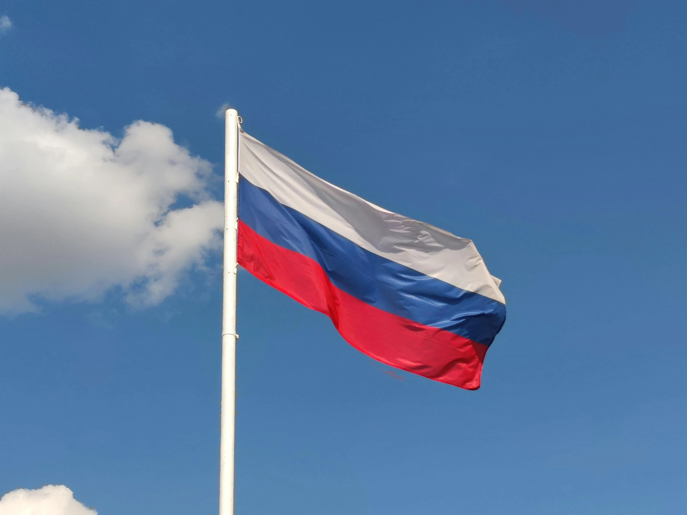 the russian flag is flying high in the sky, an album cover, by Jan Rustem, unsplash, square, high-quality photo, 5 feet away, flag