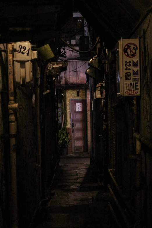 a narrow alley with signs hanging from the ceiling, inspired by Elsa Bleda, mingei, dark shadowy surroundings, deserted shinjuku junk town, doorways, in a darkly lit laboratory room