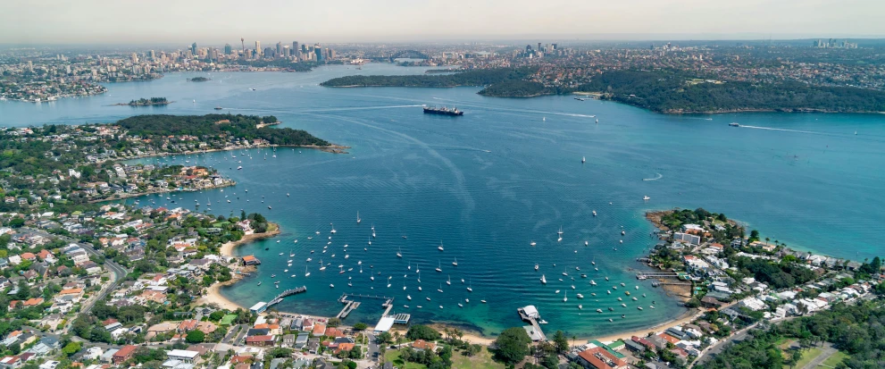 a large body of water filled with lots of boats, inspired by Sydney Carline, pexels contest winner, wide aerial shot, panorama, foster and partners, bored ape yacht club