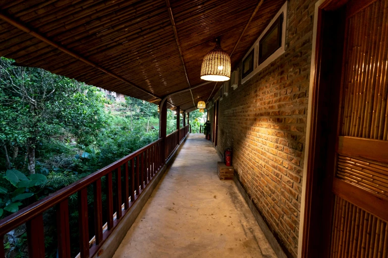 a long walkway with a lamp hanging over it, bao phan, cottage, profile image