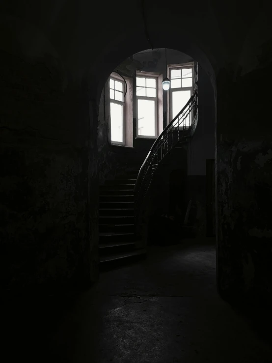 a dark room with stairs and a window, instagram picture, abandoned prague, low quality photograph, front lit