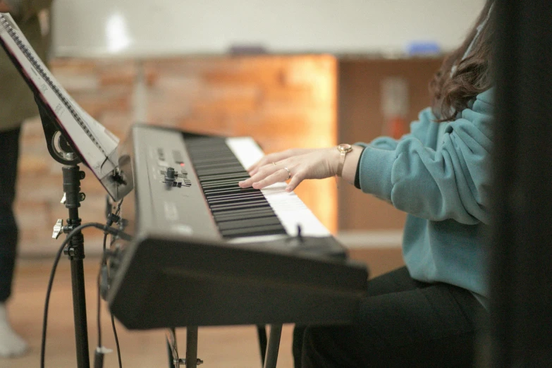 a close up of a person playing a piano, profile image, school class, brown, environmental shot