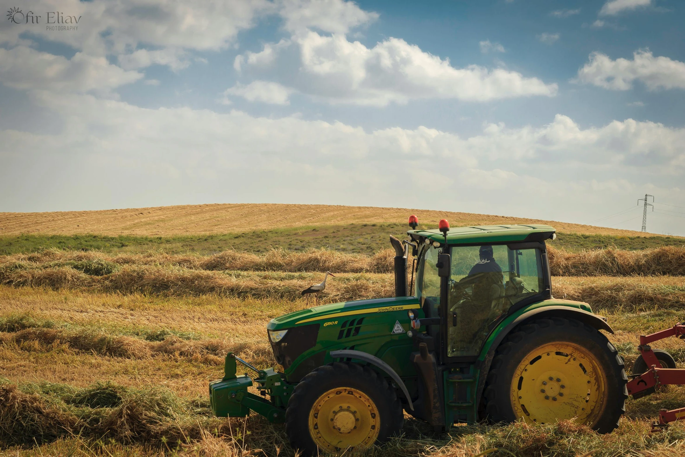 a tractor that is sitting in the grass, by Matthias Stom, unsplash, renaissance, mowing of the hay, avatar image