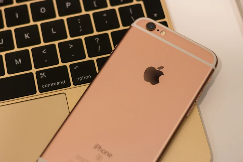 an iphone sitting next to a laptop computer, a picture, trending on pexels, renaissance, pink and gold, close up shot from the side, square, rose gold