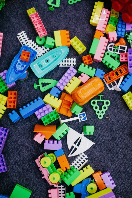 a pile of legos sitting on top of a table, thumbnail, broken toys, colorful buildings, inspect in inventory image