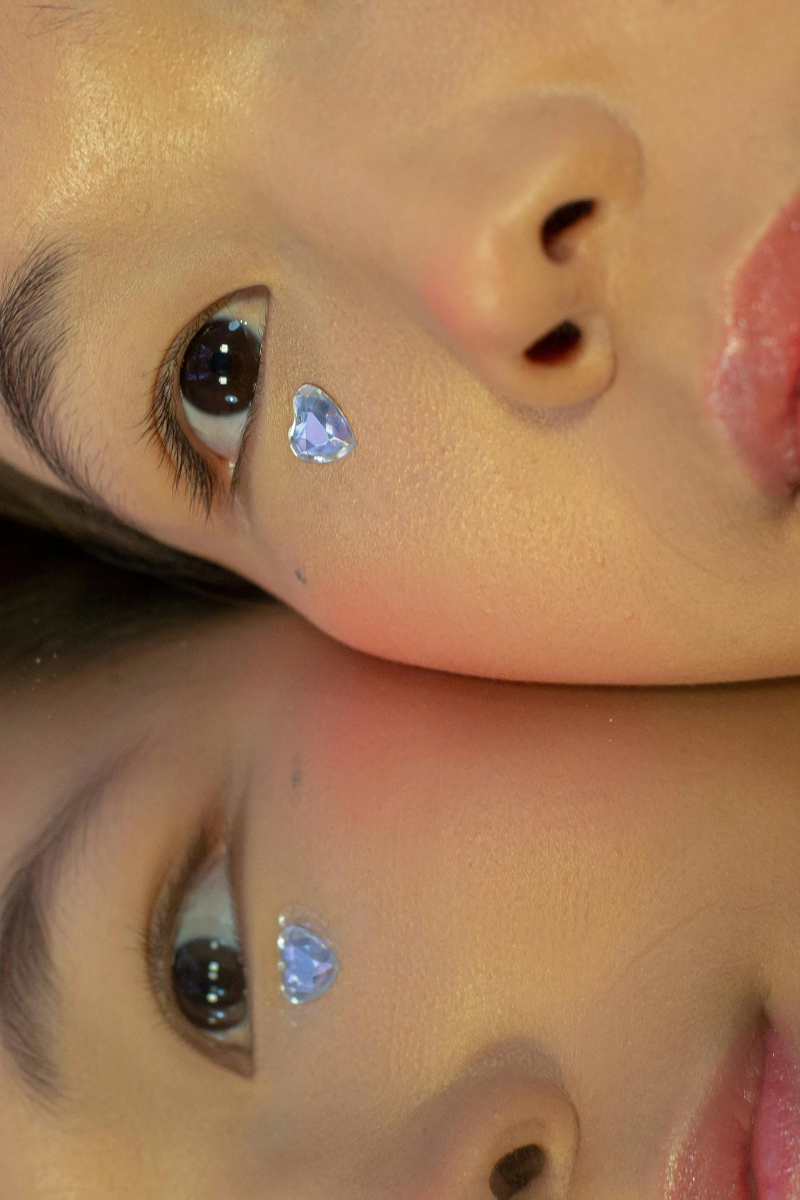 a close up of two children looking at the camera, inspired by hajime sorayama, reddit, hyperrealism, embedded with gemstones, jimin\'s right eyelid swollen, asian face, high angle shot