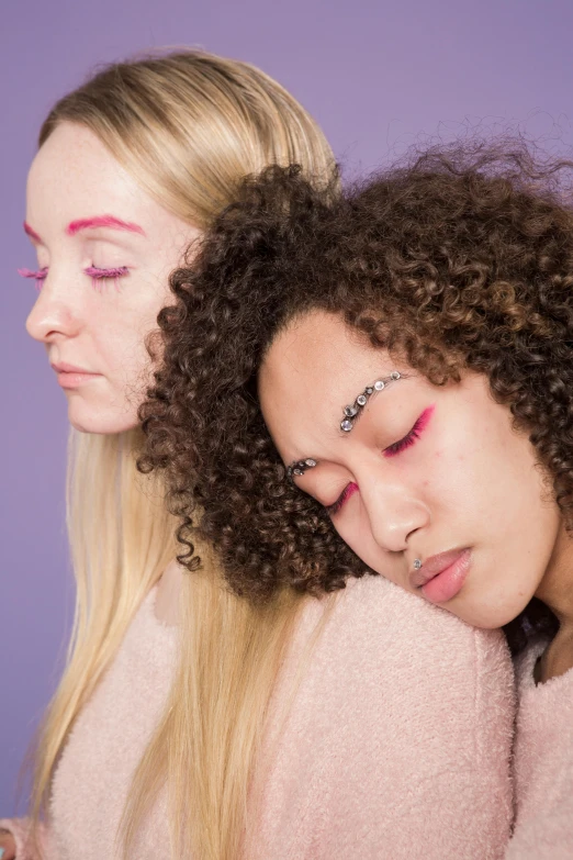 a couple of women standing next to each other, trending on pexels, aestheticism, lavender and pink eyes, laying down, nonbinary model, curls