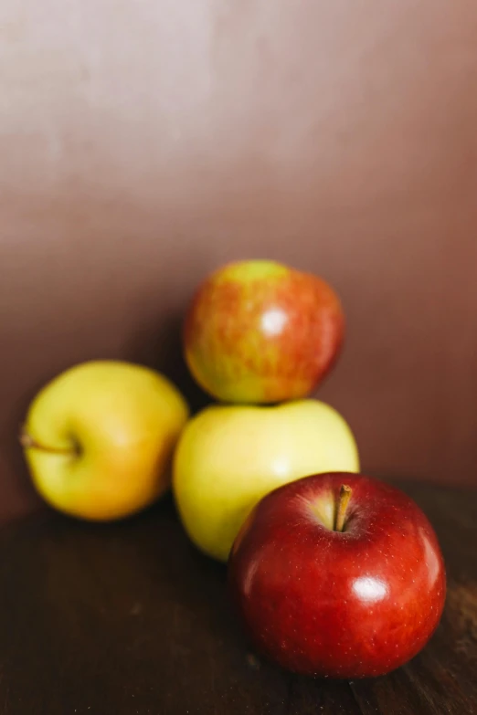 a pile of apples sitting on top of a wooden table, slide show, photograph, panel, hires