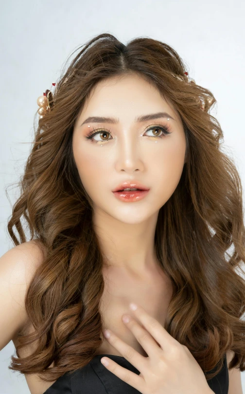 a woman in a black dress posing for a picture, by Robbie Trevino, close - up studio photo, portrait of modern darna, brown:-2, high quality image