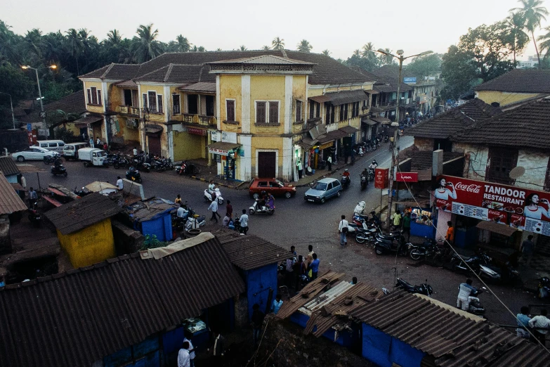a view of a street from the top of a building, on an indian street, lena oxton, portrait image