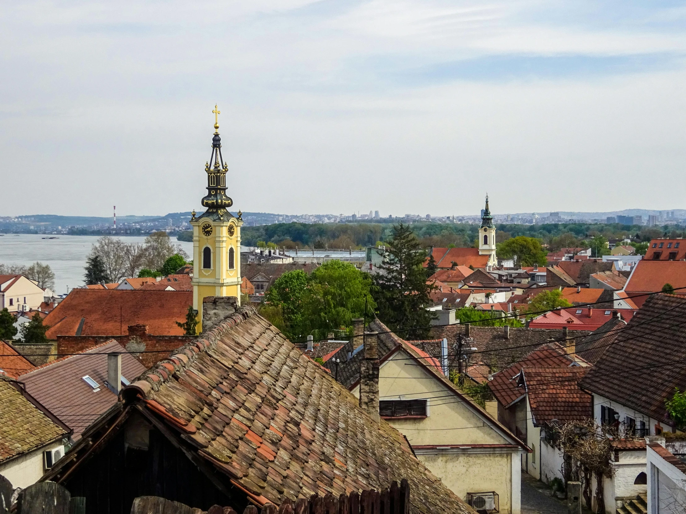 a view of a town from the top of a hill, sharp roofs, jeszika le vye, lead - covered spire, 1 petapixel image