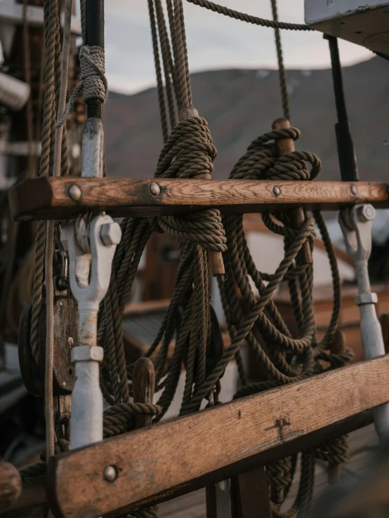 a close up of a bunch of ropes on a boat, a picture, by Niko Henrichon, pexels contest winner, renaissance, norse inspired, made of intricate metal and wood, high quality screenshot, multiple stories