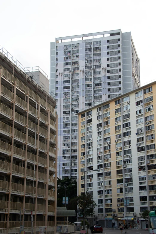 a couple of tall buildings sitting next to each other, patiphan sottiwilaiphong, soviet apartment buildings, 8k”, panels