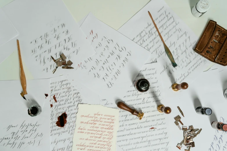 a bunch of letters sitting on top of a table, calligraphy, promo image, multiple stories, objects