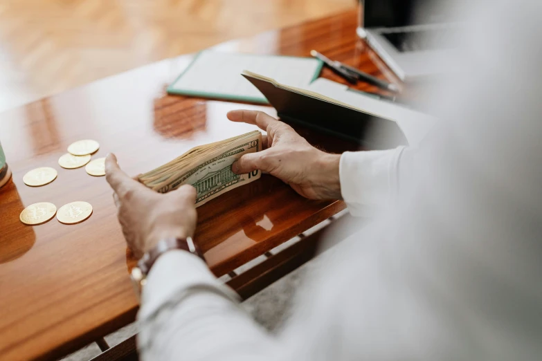 a man that is sitting at a table with a book, cash on a sidetable, thumbnail, inspect in inventory image, court session images