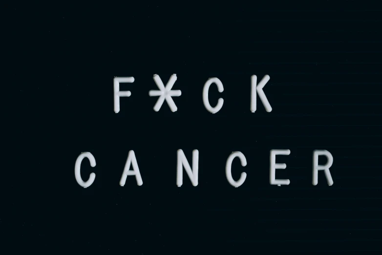 the words f ck cancer written in white letters on a black background, an album cover, abcdefghijklmnopqrstuvwxyz, background image, scarfolk, skincare