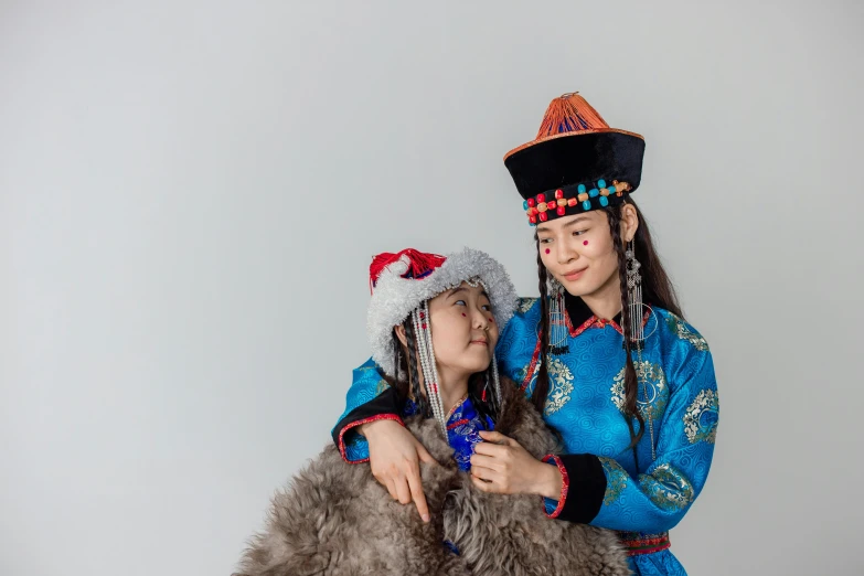 a couple of women standing next to each other, a portrait, trending on unsplash, cloisonnism, mongol, avatar image, children, in front of white back drop