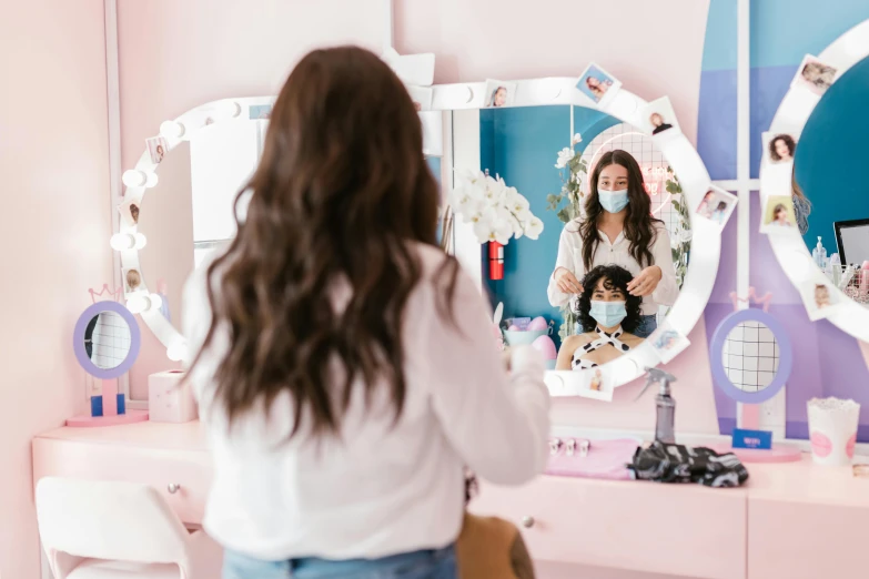 a woman that is standing in front of a mirror, candy treatments, flowy hair, masked person in corner, surgery