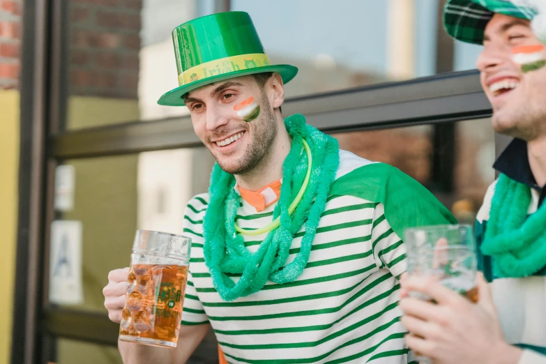 two men are celebrating st patrick's day with beer, pexels contest winner, renaissance, striped, a person standing in front of a, australian, h3h3