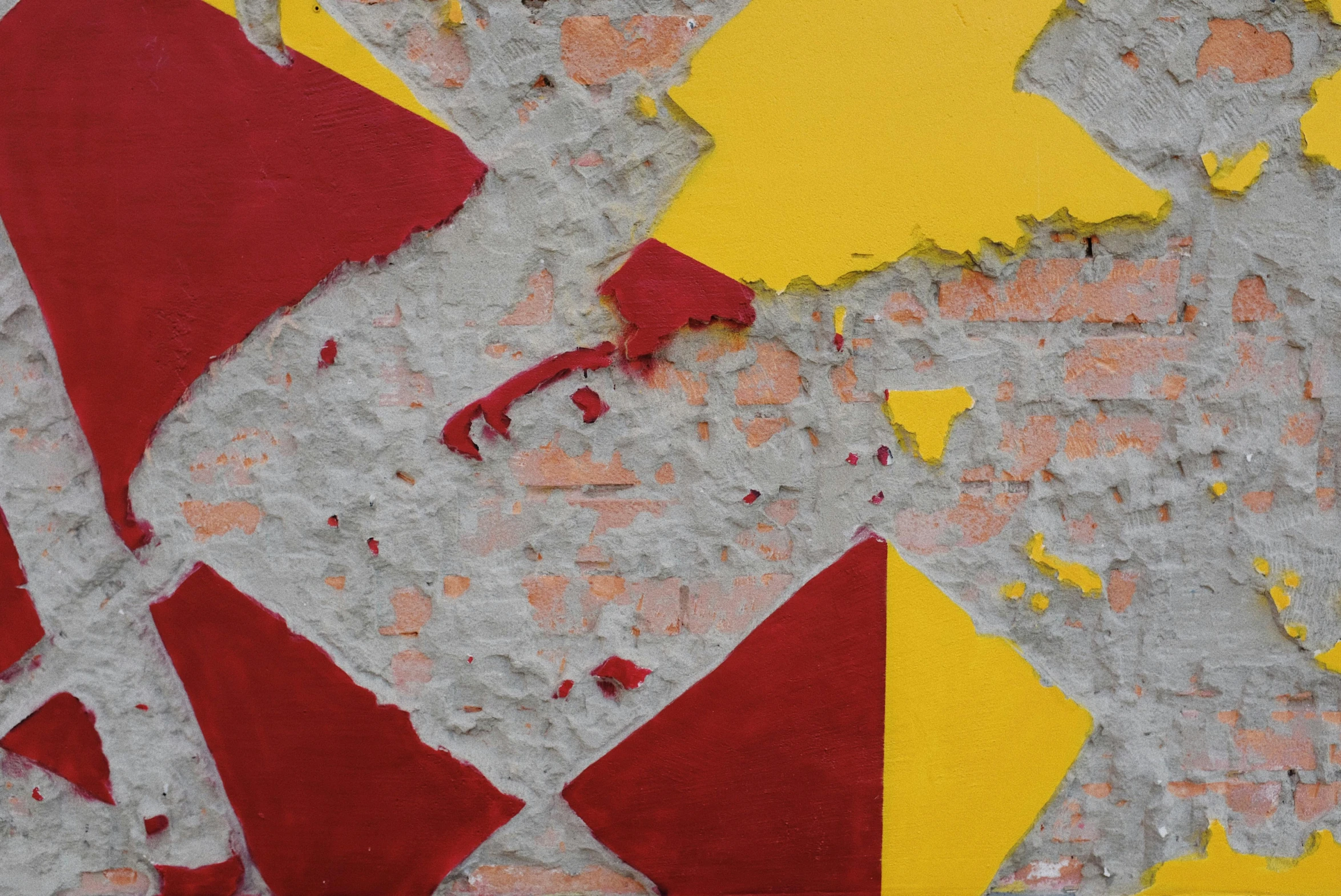 a close up of peeling paint on a wall, a mosaic, inspired by Serge Poliakoff, pexels contest winner, graffiti, scarlet and yellow scheme, thick squares and large arrows, seaside, yellow flash