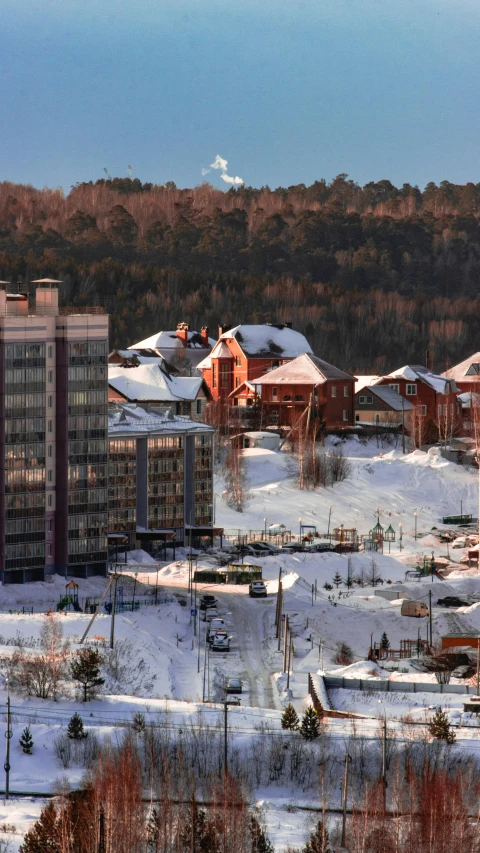 a group of buildings sitting on top of a snow covered slope, slide show, apartment, hi-res, in the winter