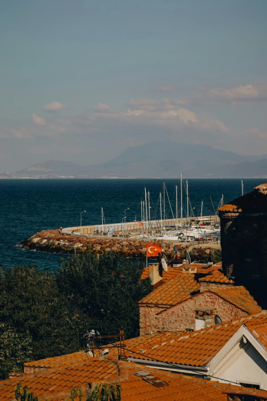 a number of buildings near a body of water, by Alexis Grimou, pexels contest winner, view of sea, shot from roofline, square, today\'s featured photograph 4k