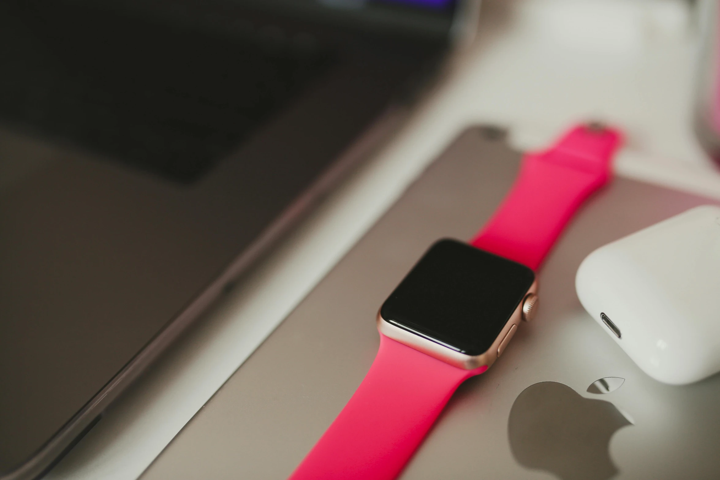 an apple watch sitting on top of a desk next to a mouse, trending on pexels, hot pink, square, up close picture, various posed