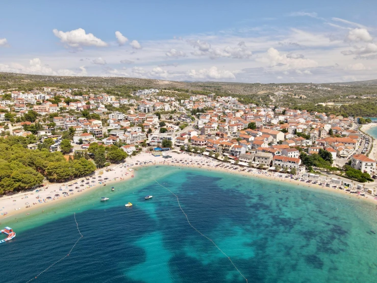 a large body of water next to a beach, pexels contest winner, renaissance, croatian coastline, square, white, neighborhood