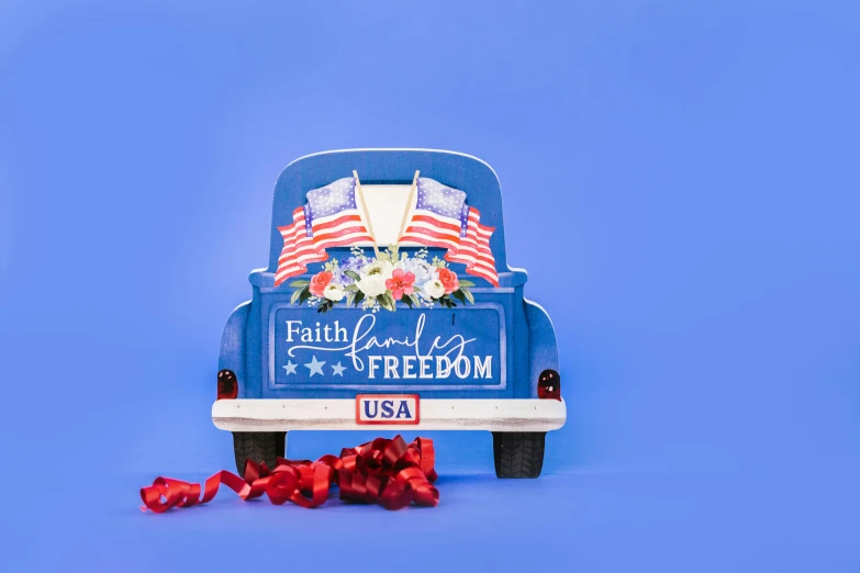 a blue truck with an american flag on the back, an album cover, by Elaine Hamilton, unsplash, 3 d print, religious, fully decorated, full front view