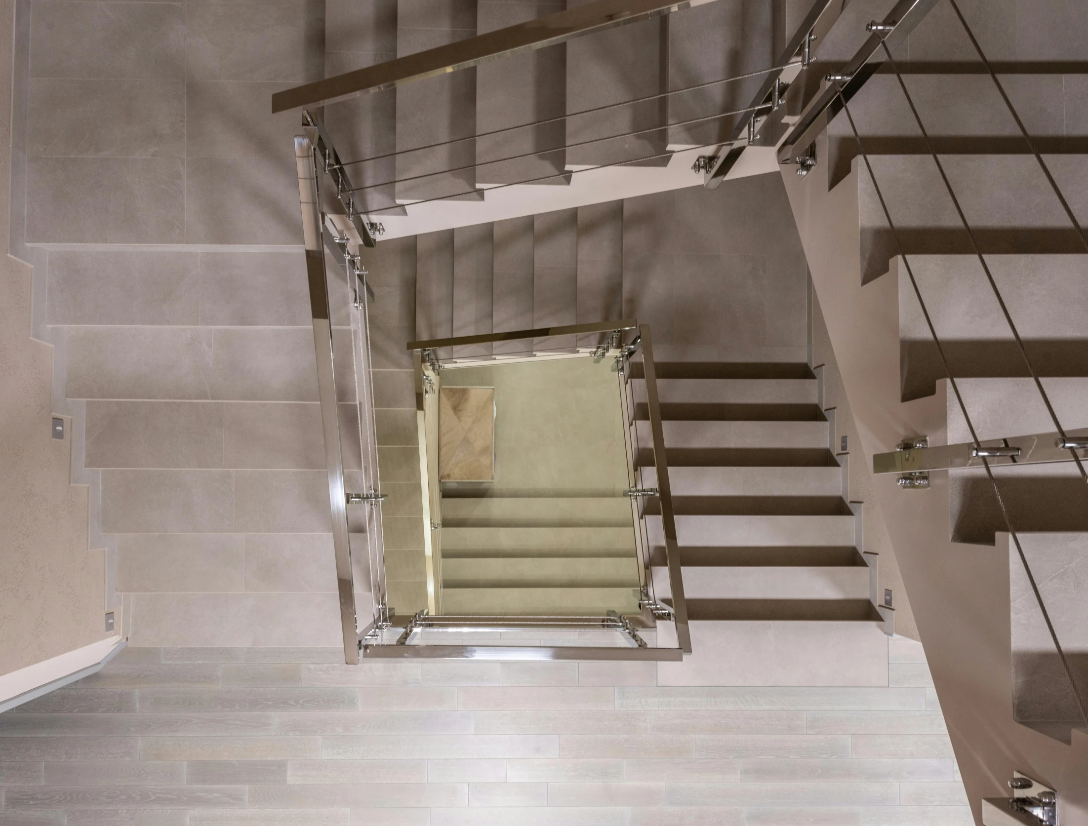 a view from the top of a set of stairs, inspired by david rubín, taupe, upscale photo, polished, bizzaro