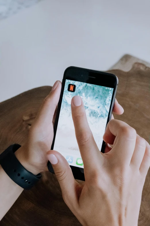 a person using a smart phone on a table, trending on pexels, interactive art, hunting, square, brown, diy