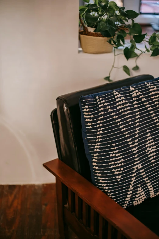 a black and white blanket sitting on top of a wooden chair, dark blue, sasai ukon masanao, detailed product image, multiple stories