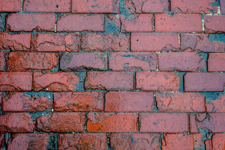 a fire hydrant sitting on the side of a brick wall, an album cover, by Jan Rustem, unsplash, floor texture, background image, after the rain, tessellated planes of rock