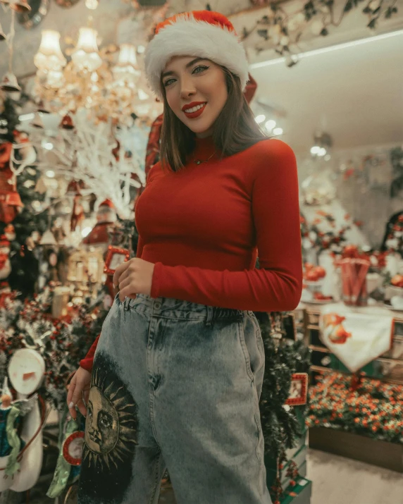 a woman standing in front of a christmas tree, trending on pexels, wearing red shorts, wearing turtleneck, the store, thumbnail