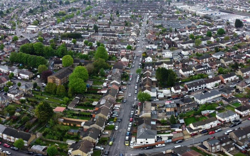 an aerial view of a city with lots of houses, by Julian Allen, barnet, documentary still, full trees, thumbnail