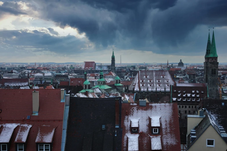 a view of a city from the top of a building, by Werner Gutzeit, pexels contest winner, baroque, nuremberg, stormy snowy weather, slide show