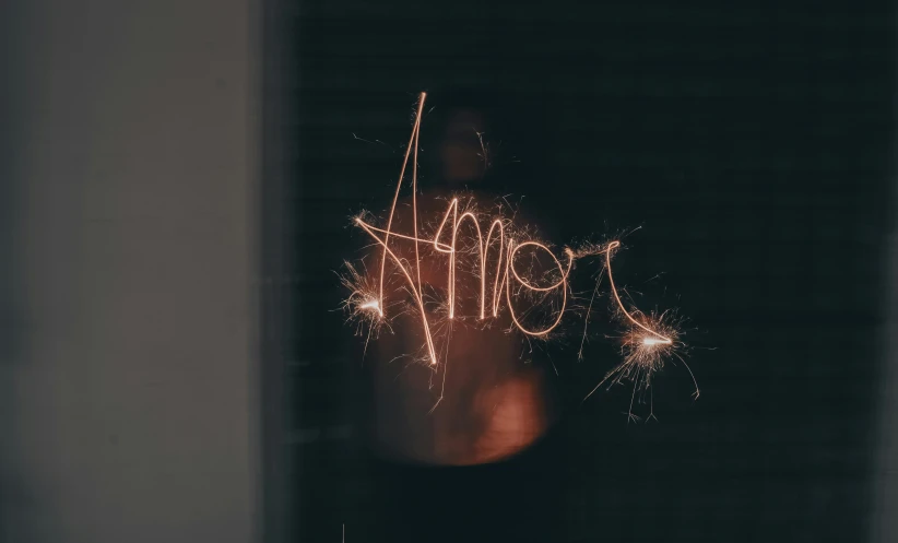 a person holding sparklers in their hands, by Emma Andijewska, graffiti, highly detailed amour, blurry photo, a labeled, almost black