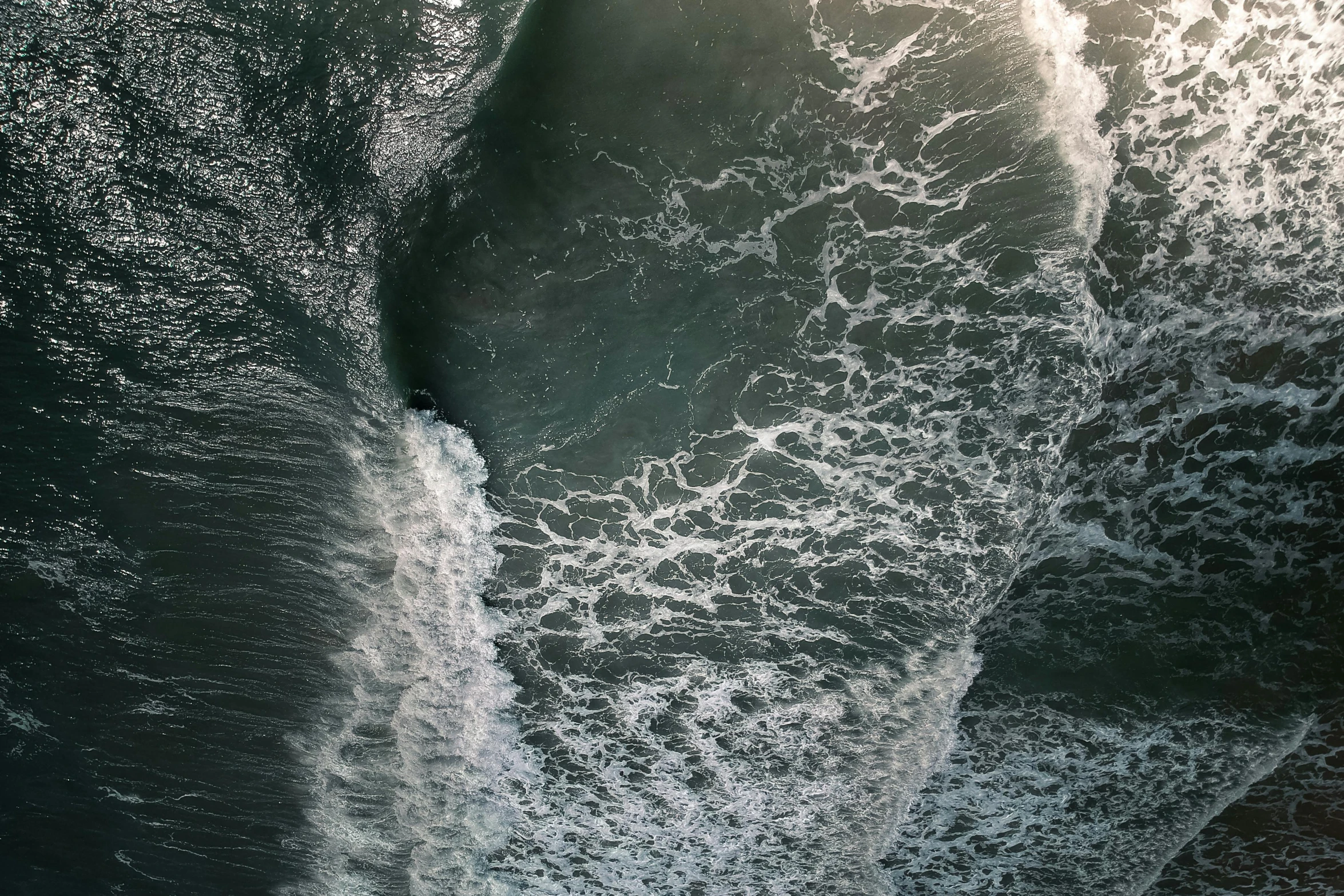 a man riding a wave on top of a surfboard, by Neil Blevins, pexels contest winner, surrealism, view from above on seascape, water flowing through the sewer, volumetric light from above, /r/earthporn