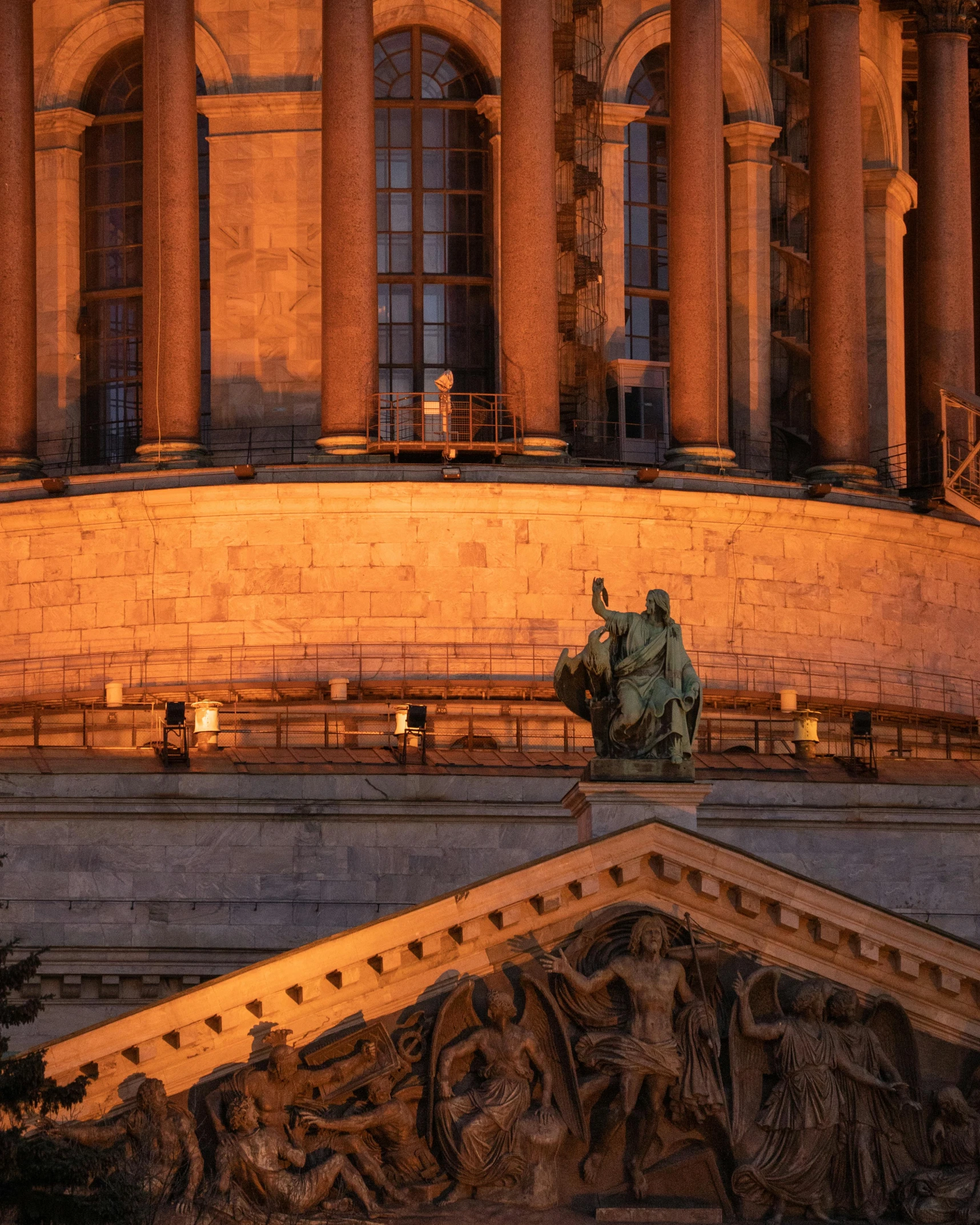 a large building with a statue on top of it, pexels contest winner, warmly lit, lgbtq, shot from roofline, national archives