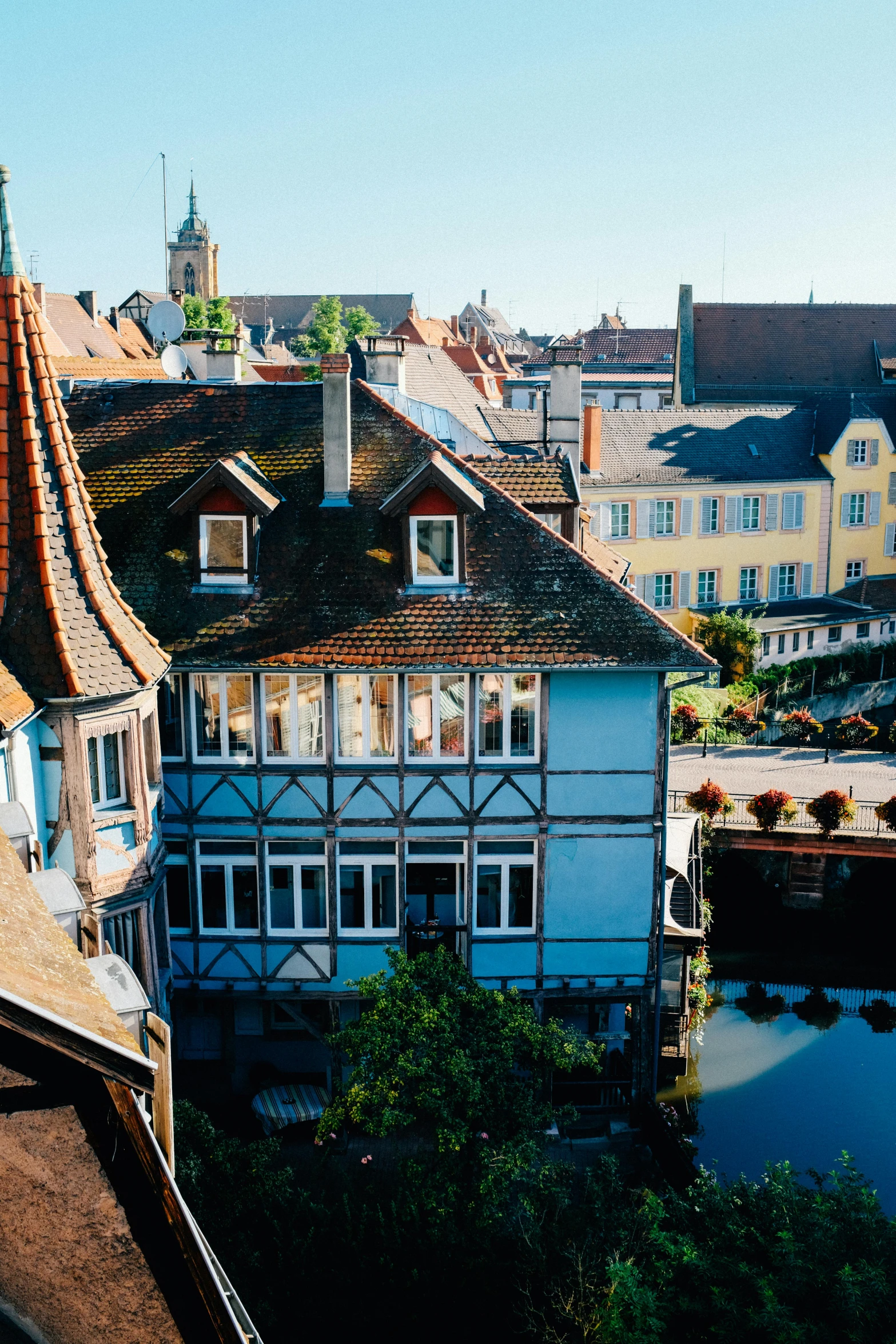 a group of buildings next to a body of water, renaissance, german renaissance architecture, quaint village, slide show, a high angle shot