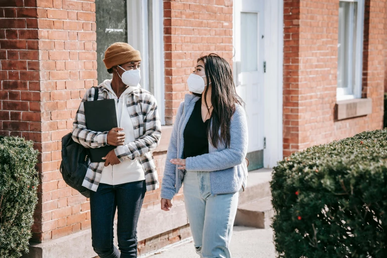 two women walking down a sidewalk wearing face masks, by Carey Morris, trending on pexels, happening, people looking at a house, student, dialogue, josh grover