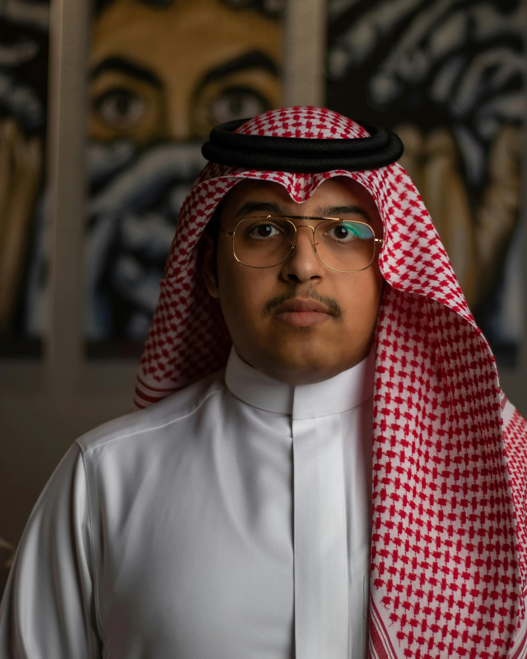 a close up of a person wearing a headscarf, an album cover, inspired by Ahmed Yacoubi, pexels contest winner, hurufiyya, jewish young man with glasses, wearing a light - pink suit, lgbtq, head and waist potrait