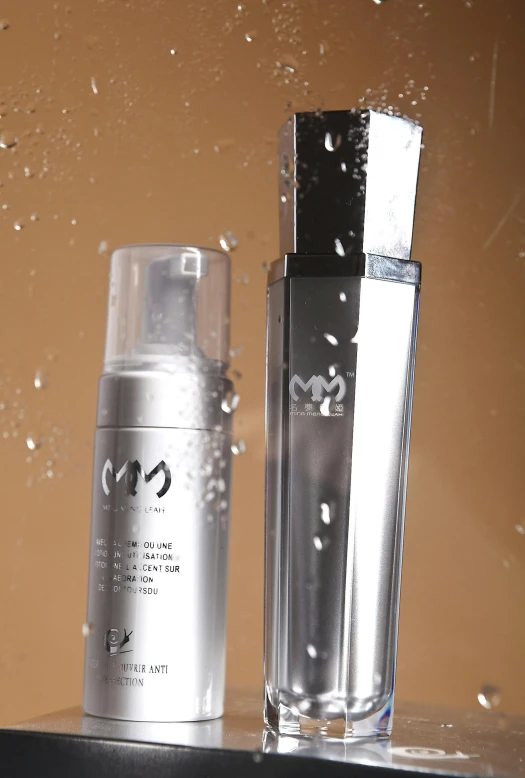 a couple of bottles sitting on top of a shelf, by Miyamoto, wet make - up, sleek waterproof design, promo image, shiny silver