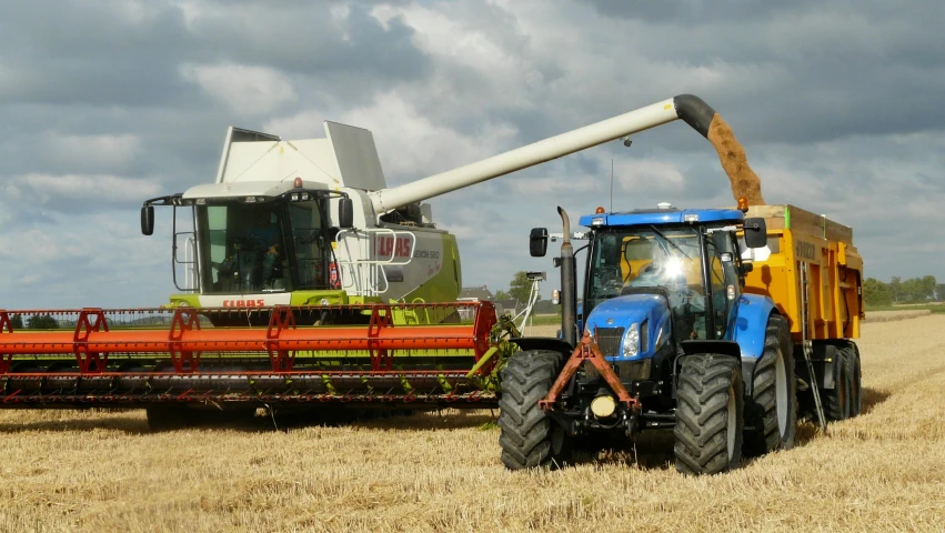 a tractor and a combine harvester in a field, pixabay, avatar image, no cropping, close - up photo, low grain film