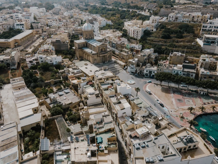 an aerial view of a city with lots of buildings, pexels contest winner, les nabis, marsden, middle eastern, low quality photo, video footage